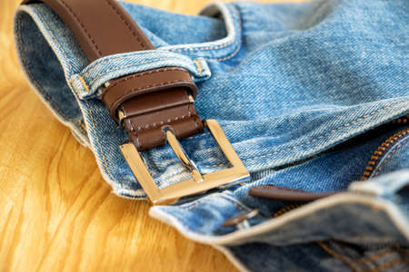 Blue jeans with leather belt