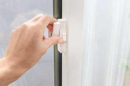 Turn the lock lever attached to the window