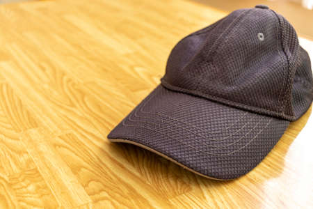 Black cap on the deskの写真素材
