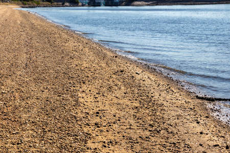 Sandy beach with small wavesの写真素材