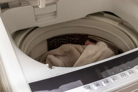 White washing machine with open lidの写真素材