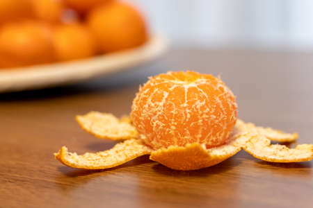 Peeled citrus unshiu on the tableの写真素材