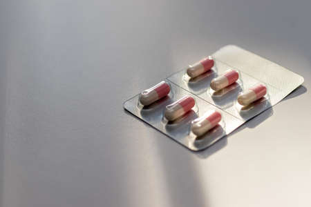 Capsules on the white table