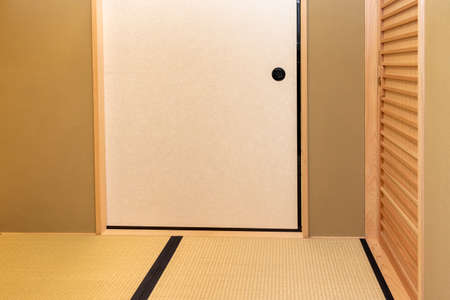 Traditional Japanese room with fusuma and tatami matの写真素材
