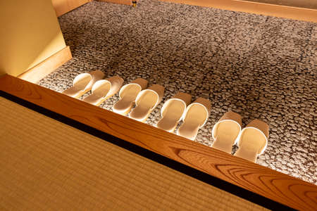 Lighted up 4 pairs of slippers at the exit of the room