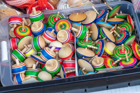 Lots of colorful spinning topsの写真素材