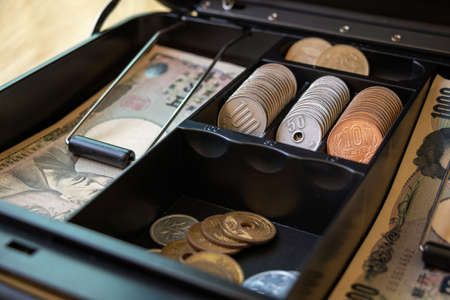 Japanese currency in a portable safeの写真素材