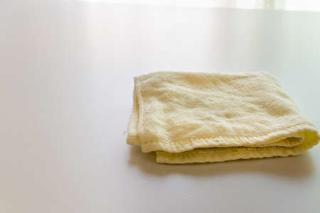 A towel folded and placed on the tableの写真素材