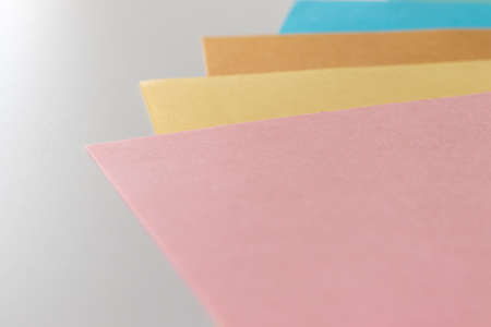 Overlapped papers with light pastel colors