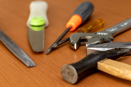 Various tools on a wooden workbench