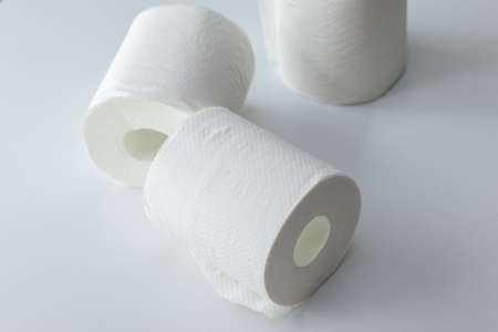 Toilet paper rolls on a white table