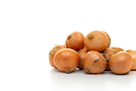 Lots of onions on the white tableの写真素材