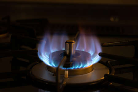 Blue flame from the burner of the gas stove