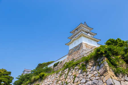 Look up the white turret on the stone wallのeditorial素材
