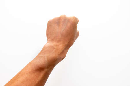 Stick out the fist of the left hand