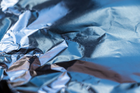 Surface of aluminum foil shining blueの写真素材