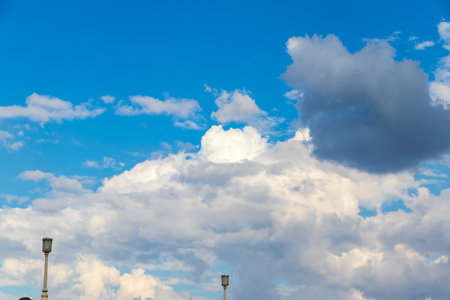 Blue sky and white cloud over the cityの写真素材