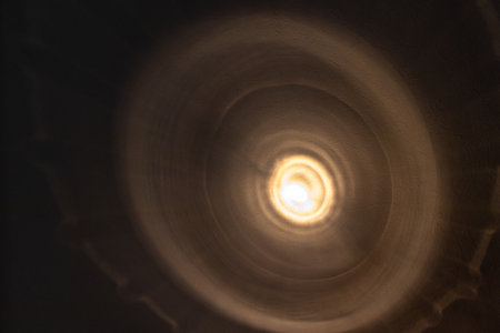 White light shining on dark wallの写真素材