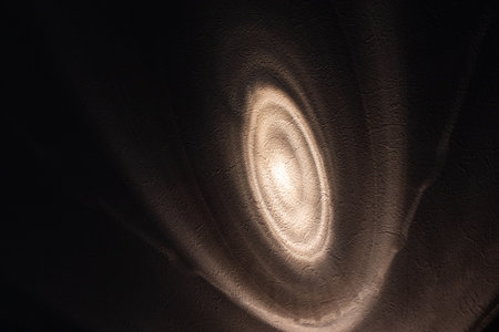 White light shining on dark wall