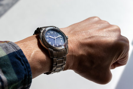 Men's wrist watch on a white background, close-up.の写真素材