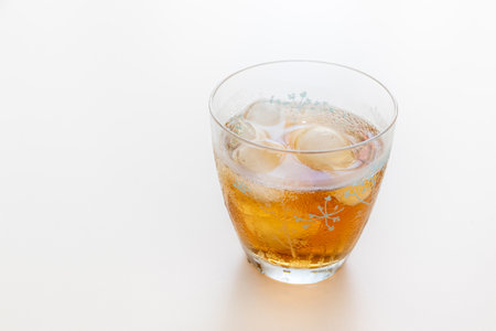 Cold tea with ice in a glassの写真素材