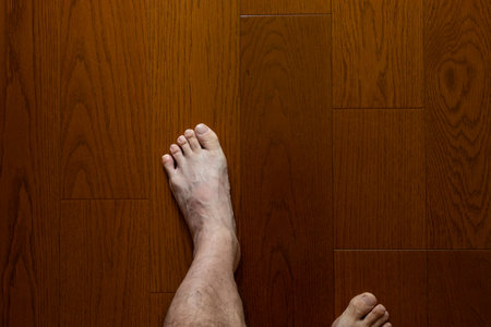 walk barefoot on a wooden floorの写真素材
