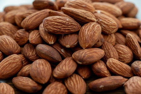 A pile of almonds on the tableの写真素材