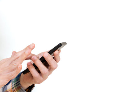 Hand of a person operating a smartphone