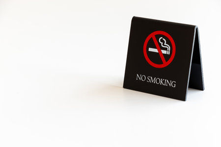 No smoking sign on white table. Isolated on white background.の写真素材