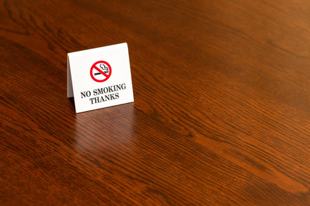No smoking sign on a wooden table. Copy space for text.の写真素材