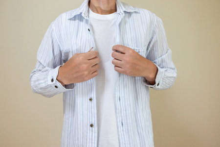A man wearing a light blue shirt