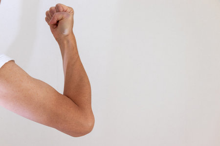 A man posing with one arm bent