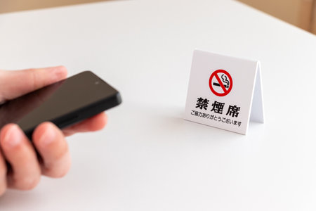 Using a smartphone at a non-smoking table