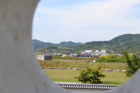 View from the circle hole of white castle wall in Ako Castleの写真素材