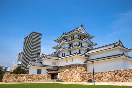 White castle tower with green open space in Amagasaki Castleの写真素材