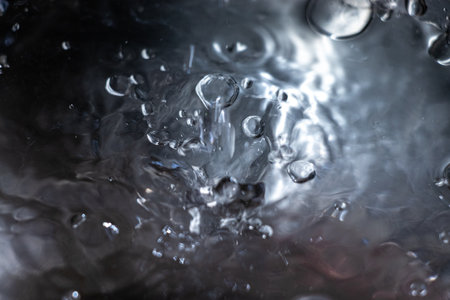 The texture of the bubbling, rippling water surfaceの写真素材