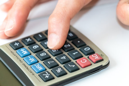 Tap the calculator keys with a finger