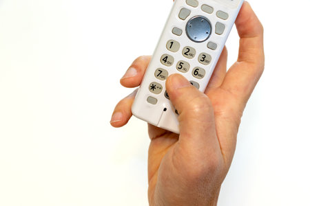 Press the button on the handset to make a callの写真素材