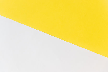 Background material divided into yellow and whiteの写真素材