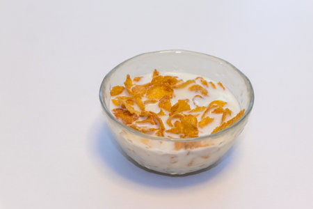 Corn flakes soaked in milk in a bowl