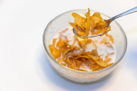 Corn flakes soaked in milk in a bowl