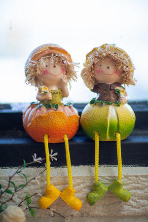 Halloween decoration with pumpkins and scarecrows on the roofの写真素材