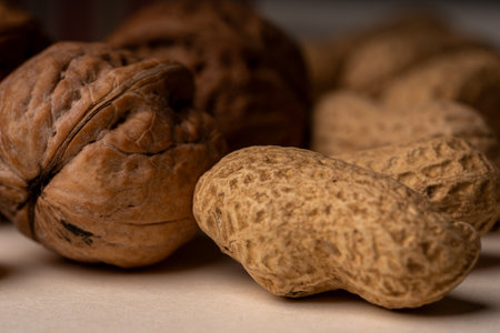 Walnuts and pecan nuts on a wooden background. Toned.の写真素材