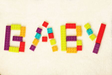 word of BABY shaped by colorful toy bricks.の写真素材