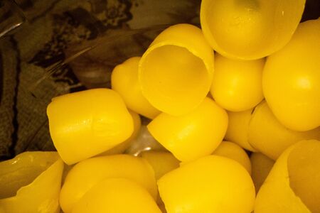 Yellow wax bowls for hatching bees. Developing of bee close up.の写真素材
