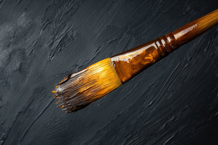 A paintbrush dipped in thick oil paint. Close upの写真素材