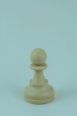 White pawn of chess board isolated backgroundの写真素材