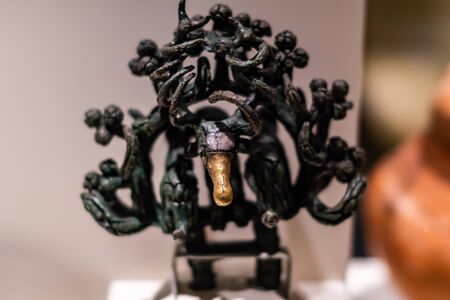 Hittite sun disk  figures from bronze age foundings in excavation of Hattusa Bogazkoy Reliefs tablets statues walls gates cylinder seals stamp sealsのeditorial素材