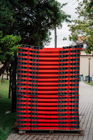 red plastic items in a stack outdoorの写真素材