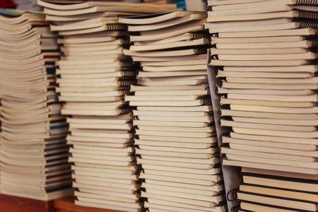 Stack of notebooks and books close -upの写真素材
